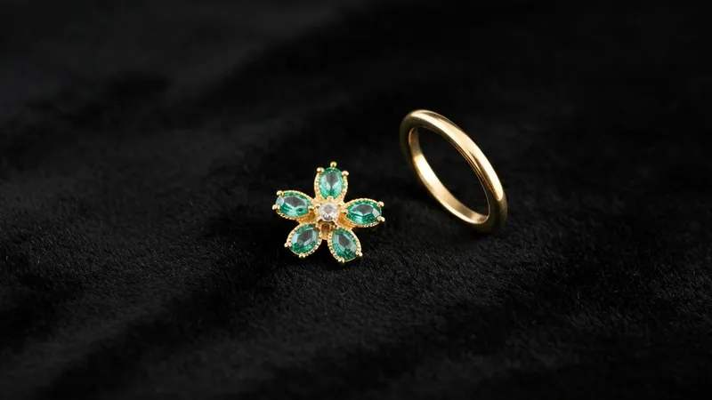 Les boucles d'oreilles en émeraude et or